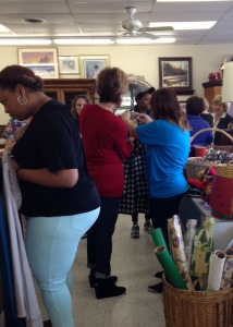 women buying clothes at upscale resale store