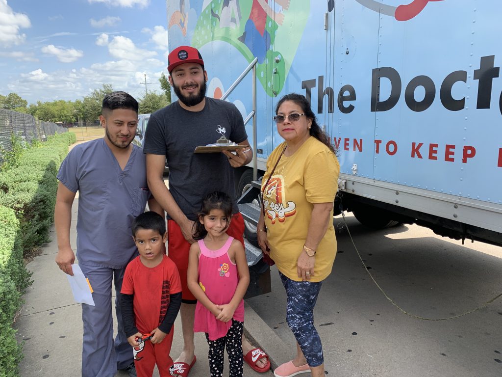 family going into The Doctor Spot for medical services