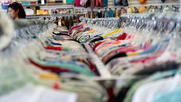 shirts on hangers at thrift store