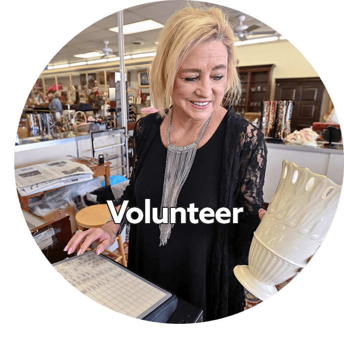 woman volunteering at upscale resale