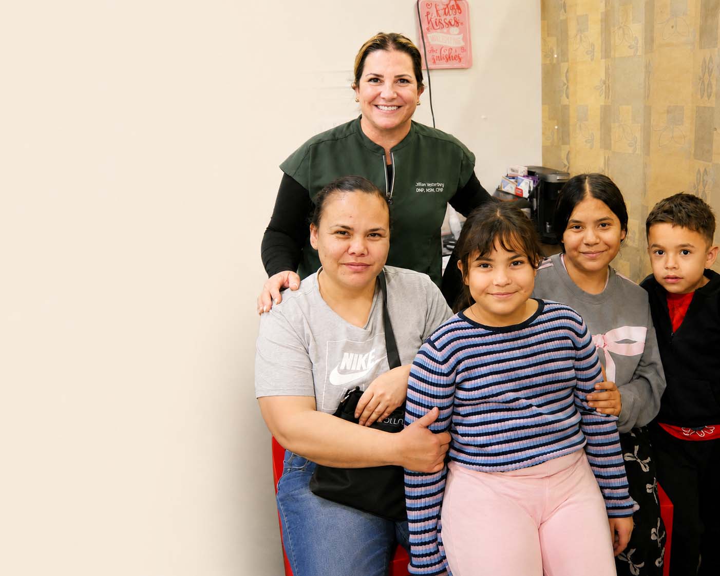 Nurse practitioner from The Doctor Spot with family