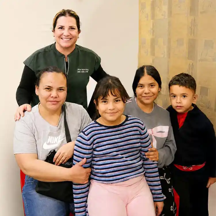 Nurse practitioner from The Doctor Spot with family